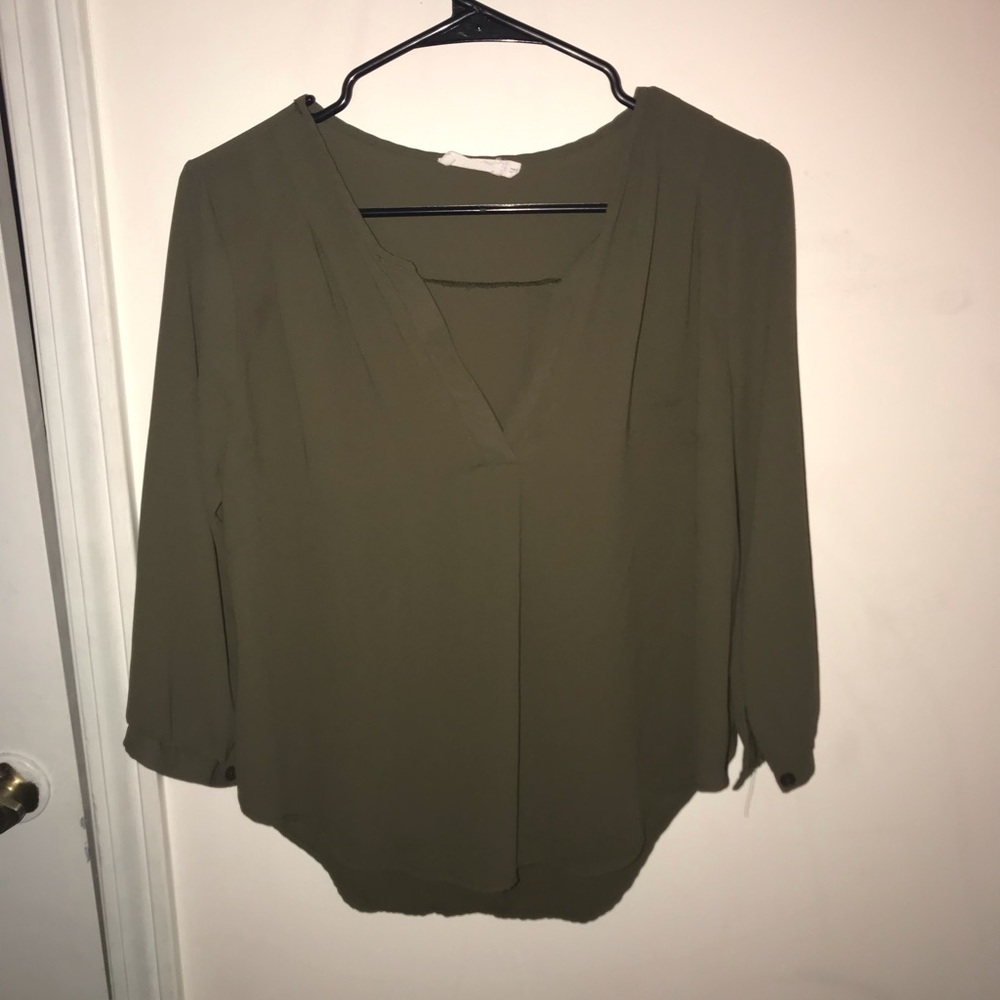 Olive green slight v-neck blouse.